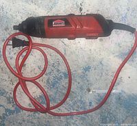 Side view of the Jobmate rotary tool showing the red and black body, logo label and power cord.