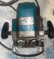 Top view showing Makita model and serial number plate, and both side handles.