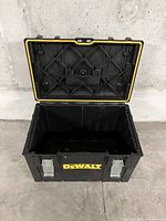 Photo of open empty DeWalt toolbox from top angle showing interior and lid structure