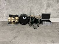 Full drum kit setup showing 5 drums, cymbals, hardware, and cases.