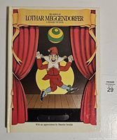 Front cover of the animated puppet book showing puppet figure and stage curtains.