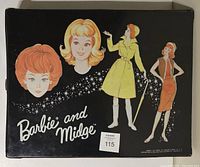Top view of the black vintage Barbie and Midge case with illustrations of the dolls in outfits and faces on the exterior.