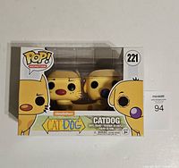 Front of original box showing CatDog vinyl figure with Pop Animation logo, figure number 221, and Nickelodeon branding.