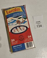 Original unopened box of Laurentian Coloured Pencils with bright red, blue, and yellow box design, showing brand Sanford and 24 brilliant colours noted
