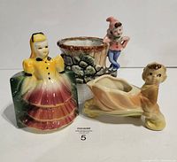 Three Japan pottery planters grouped together for overview.