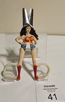 Front upright view of vintage Wonder Woman scissors showing the figure in full detail and scissor blades upright.