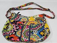 Front view of Vera Bradley hobo handbag with bright multicolor quilted RIO pattern and shoulder strap.