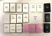 Top-down photo showing all 19 Chanel perfume sample boxes arranged neatly in rows by fragrance.