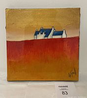 Front view of square painting showing red-orange lower field, gold/beige sky and blue-white house silhouettes with MaxSold lot card visible