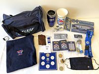 Overall lot overview with all items arranged on table showing entire collection of Blue Jays memorabilia