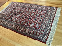 Full view of rug laid flat on hardwood floor