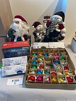 Full lot with Santa and snowman figurines and boxed vintage ornaments