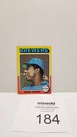 Front of 1975 Topps Hank Aaron baseball card showing player portrait, Brewers team, and autograph facsimile.