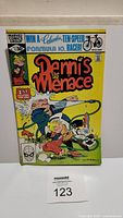 Front of Dennis The Menace comic book showing bright colorful cover art, Marvel Comics Group logo, and issue details.