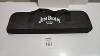 Closed black carrying case with Jim Beam logo printed in white on the front