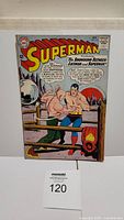 Front cover photo showing Superman #164 comic book from October 1963 with title and artwork of fight between Superman and Luthor.