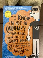 Front cover of 'Wonder' showing quote and design featuring a ten-year-old kid illustration.