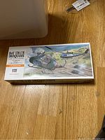 Box of the Bell UH-1H Iroquois scale model kit showing box art of helicopters in flight.
