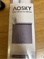 AOSKY branded cordless roller blind in box showing brand and product type.