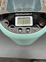 Close-up of the digital control panel with function buttons and display showing timer set to 1:30.