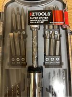 Set displayed in plastic case showing 19 pieces including spin force drill handle and bits