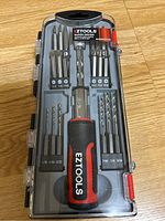 EZTools Superdriver hand tool set in closed plastic case with bits visible through case lid.