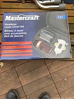 Box of Mastercraft Hawkeye Laser Level Kit with product details and branding visible.