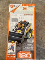 Front view of Hexbug VEX Robotics Skid Steer toy box showing model image and item details with over 180 pieces and STEM starter label.