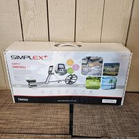 Box of Nokta Simplex+ metal detector showing model, features, and usage environments such as all metals detection, field, park, and beach use.