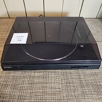 Top view of Sony record player with closed transparent dust cover showing overall condition and design.