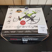 Closed box showing Zero Gravity Talon drone packaging with green drone photo and features listed