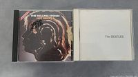 The Rolling Stones - Hot Rocks and The Beatles (White Album) CDs front cases
