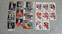 Full view of all 18 Hockey Heroes cards laid out on a grey surface showing player images and designs.