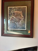Front view of framed cheetah portrait picture showing detailed animal image and frame.