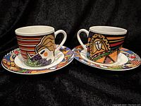 Two sets of demitasse cups and saucers shown front with visible detailed colorful abstract faces and geometric patterns