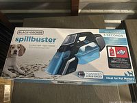 Top and front view of the sealed box showing the product and branding including dog for pet messes.