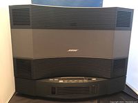 Front view of Bose Acoustic Wave Music System II showing main black grille and Bose logo.