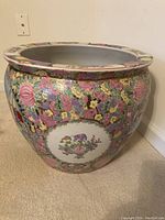 View showing front floral and scene artwork on the ceramic bowl