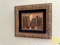 Framed signed oil painting of a historic San Francisco street scene with trolley and Victorian buildings.
