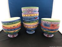 Eight colorful Sango ice cream bowls stacked and grouped, showing varied designs and colors on the outside.