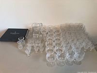 Full lot arranged on flat surface showing multiple stemware and serveware pieces