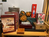 Overview of all 11 boxes arranged on a shelf, showing sizes, shapes, and colors