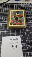 Stack of basketball cards with Michael Jordan as the top card in plastic sleeve.