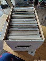 Top view of short box full of comics stacked vertically
