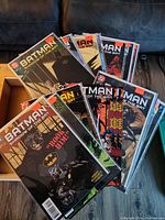 Top view of multiple Batman: Shadow of the Bat comics with varying covers and some orange price stickers shown prominently.