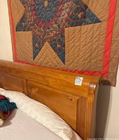 Close-up view of the headboard showing wood panel detail and finish.