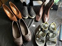 Overview of all five pairs of ladies shoes showcasing styles and colors
