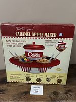 Photo of unopened box The Original Caramel Apple Maker with candy shop themed graphics and product features
