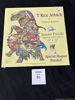 Full view of the front box of T Rex Attack puzzle showing brand, piece count, and size