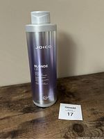 Front of Joico Blonde Life Purple Shampoo bottle showing product name and details.